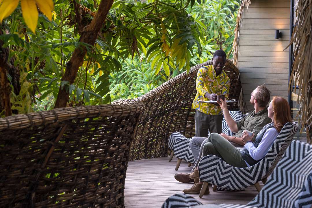 Guest enjoying a cup of tea after a gorilla trek
