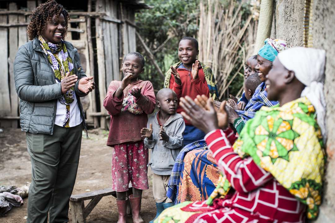 Wilderness staff member pictured with the local community in 'Bisate Village'