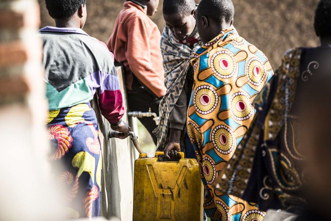 Local community members using the village water infrastructure